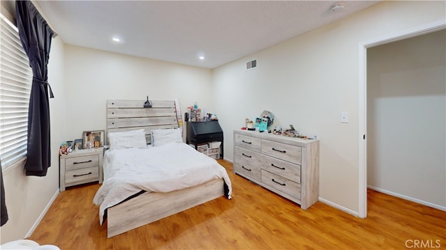 bedroom featuring light wood-type flooring