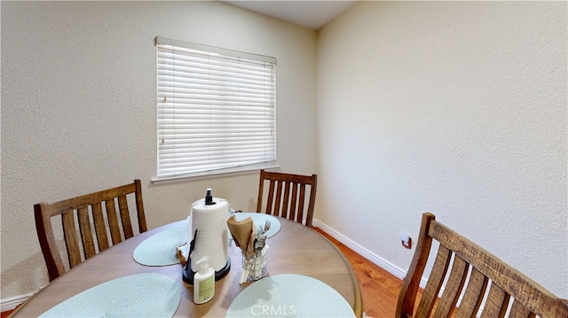 dining room with hardwood / wood-style floors