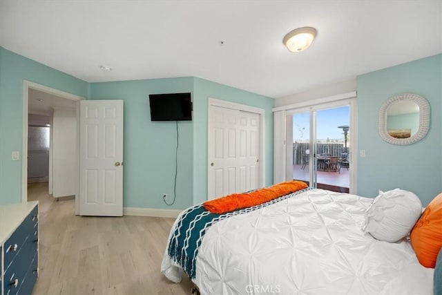 bedroom featuring access to outside and light wood-type flooring