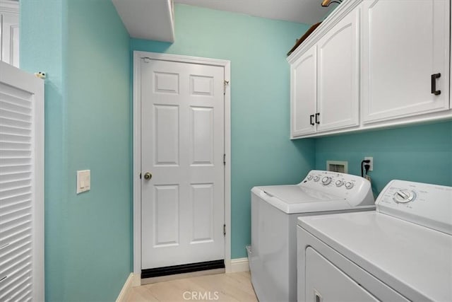 laundry area featuring cabinets and washer and dryer