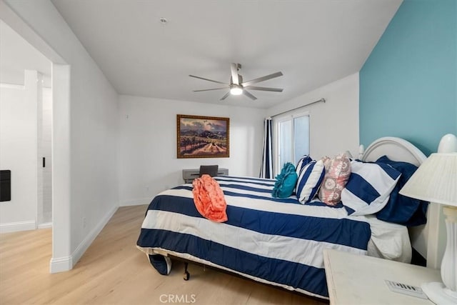 bedroom with ceiling fan and light wood-type flooring