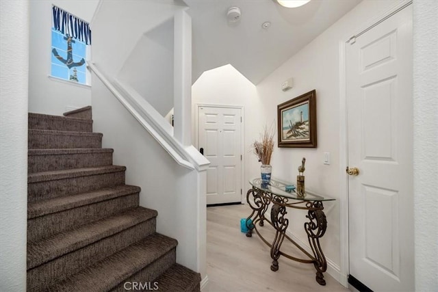 stairway featuring hardwood / wood-style floors