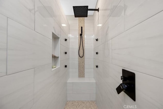 bathroom with tiled shower