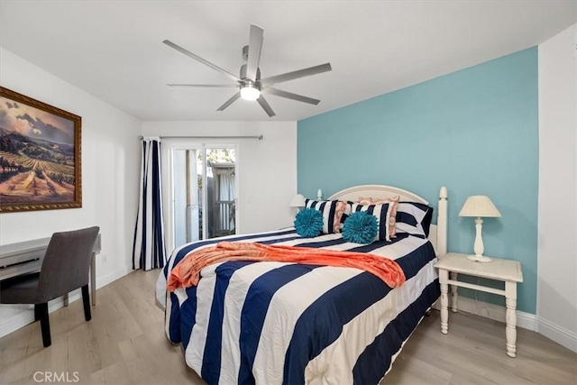 bedroom with light wood-type flooring and ceiling fan