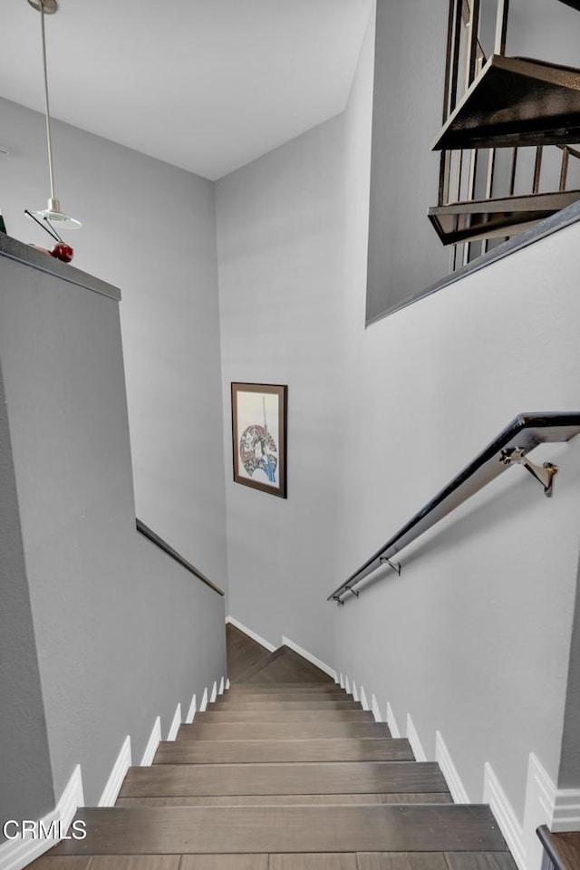 staircase featuring hardwood / wood-style flooring