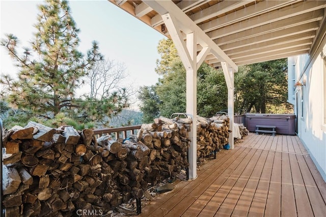 wooden terrace with a hot tub