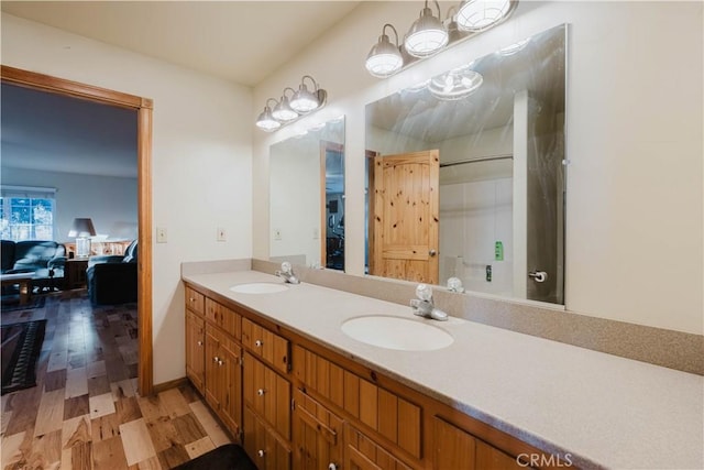 bathroom with hardwood / wood-style floors and vanity