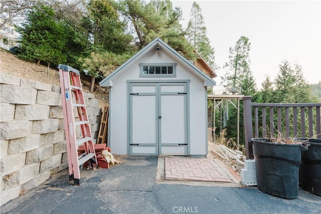 view of shed with fence