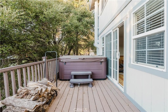 deck with a hot tub