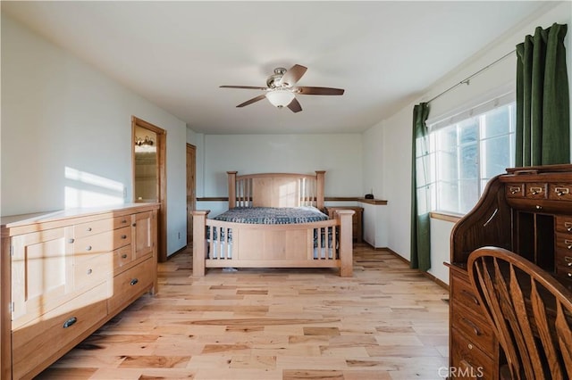 bedroom with ceiling fan and light wood-type flooring