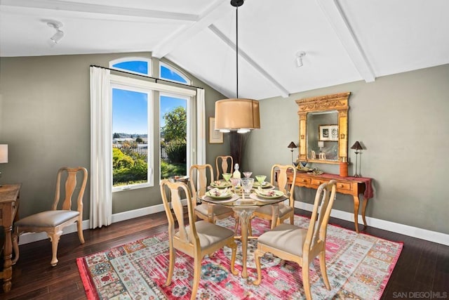 dining space with vaulted ceiling with beams and dark hardwood / wood-style floors