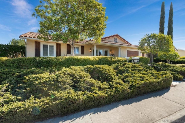 ranch-style house featuring a garage