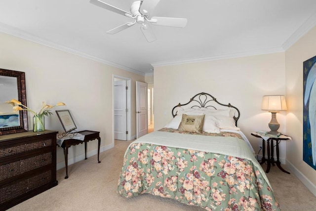 carpeted bedroom featuring ceiling fan and ornamental molding