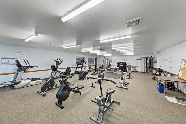 workout area featuring a textured ceiling