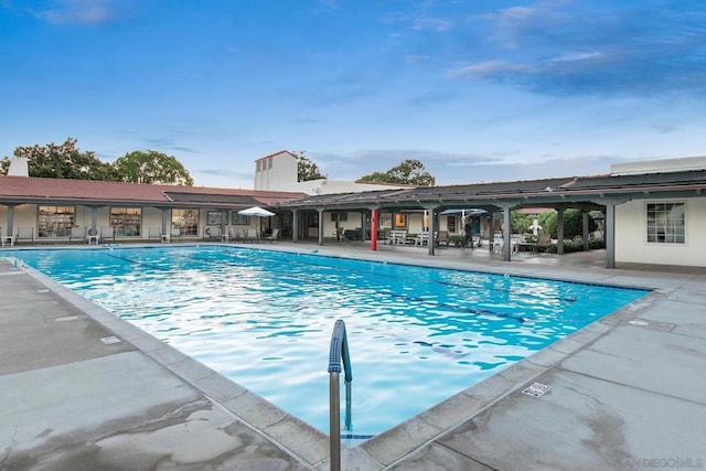 view of swimming pool featuring a patio area