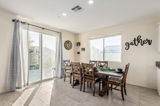 tiled dining area with plenty of natural light