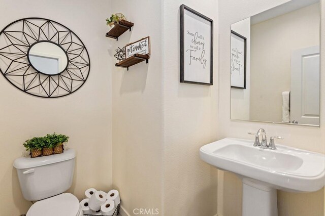 bathroom with toilet and sink