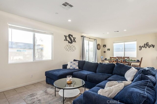 living room with light tile patterned flooring