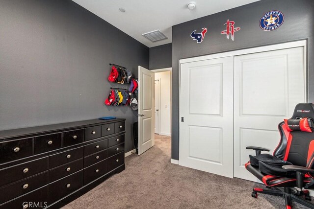 carpeted bedroom featuring a closet