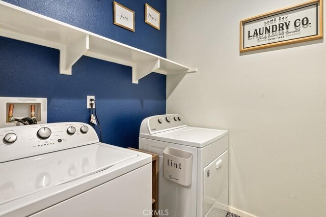 washroom with separate washer and dryer