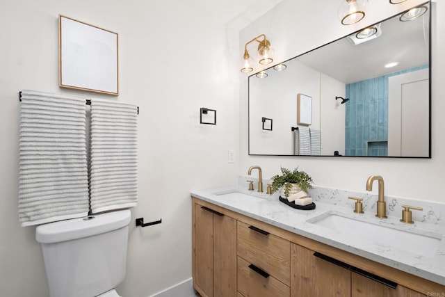 bathroom featuring toilet and vanity