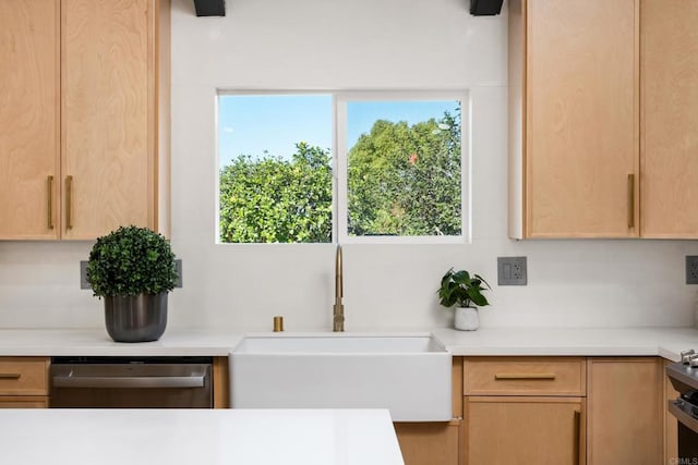 kitchen featuring sink, a wealth of natural light, light brown cabinetry, and dishwasher