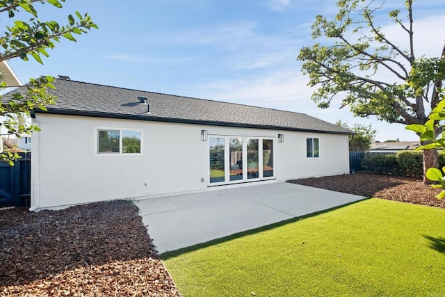 rear view of property featuring a patio