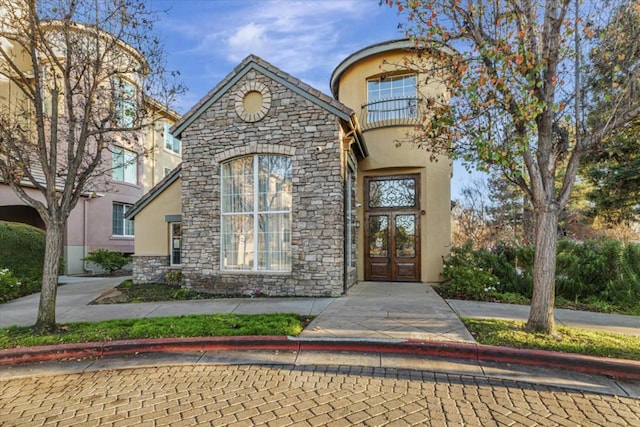 view of exterior entry featuring french doors