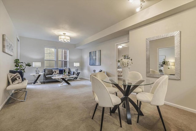 view of carpeted dining space