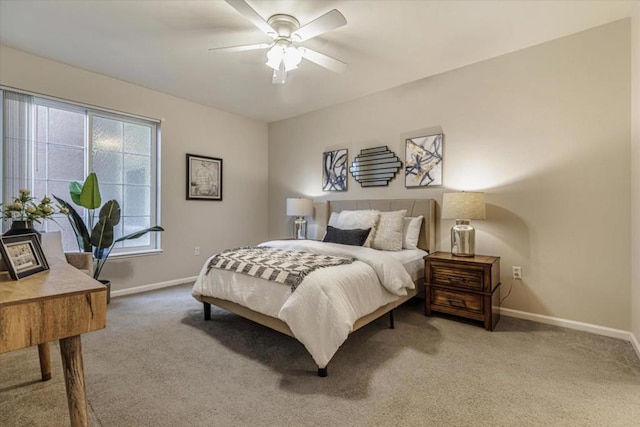 bedroom with ceiling fan and carpet flooring