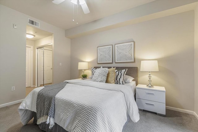 bedroom featuring ceiling fan, a closet, and carpet flooring