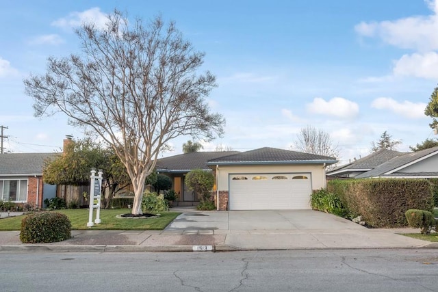 ranch-style house with a front lawn and a garage