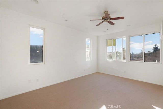 carpeted empty room with ceiling fan