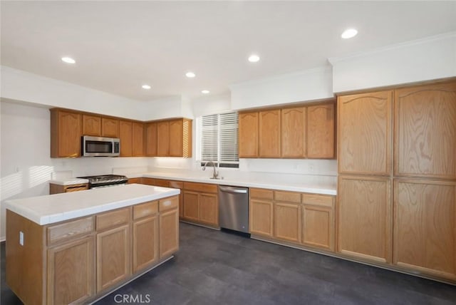 kitchen featuring appliances with stainless steel finishes, crown molding, and sink