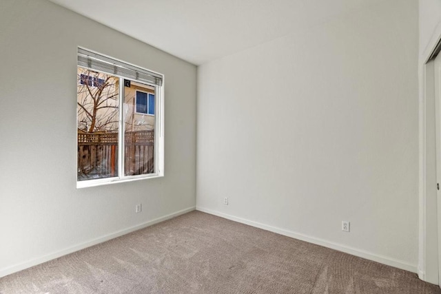 unfurnished room with carpet flooring