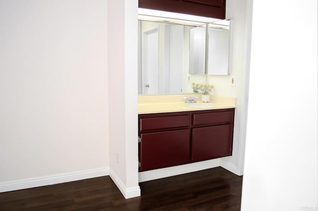 bathroom featuring vanity and hardwood / wood-style floors