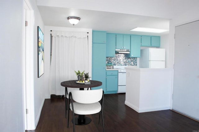 kitchen with white appliances, dark wood-type flooring, blue cabinets, and decorative backsplash