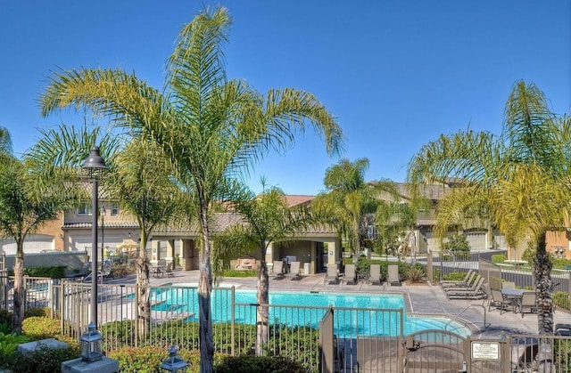 view of swimming pool featuring a patio area