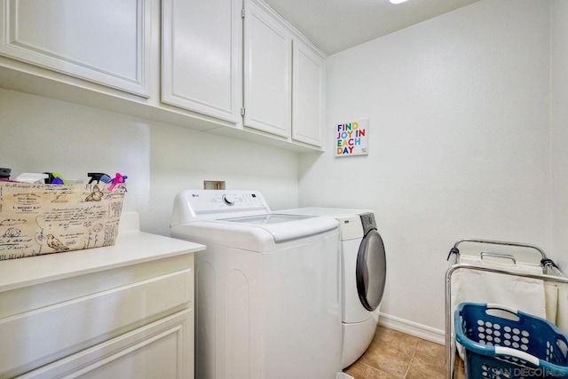 laundry area featuring cabinets and separate washer and dryer