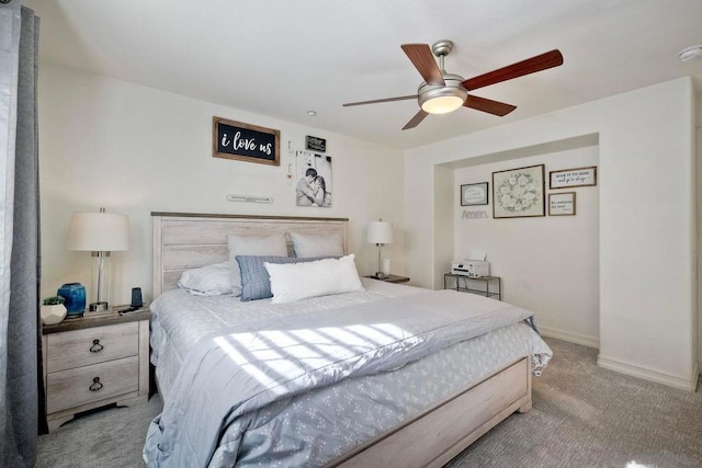 bedroom featuring ceiling fan and light colored carpet