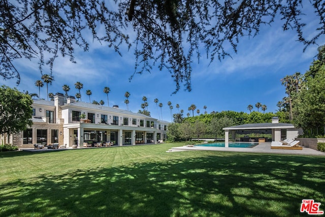 surrounding community with a swimming pool, a yard, and a gazebo