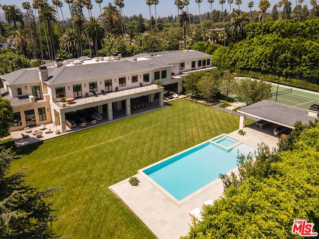 exterior space with a patio and a lawn