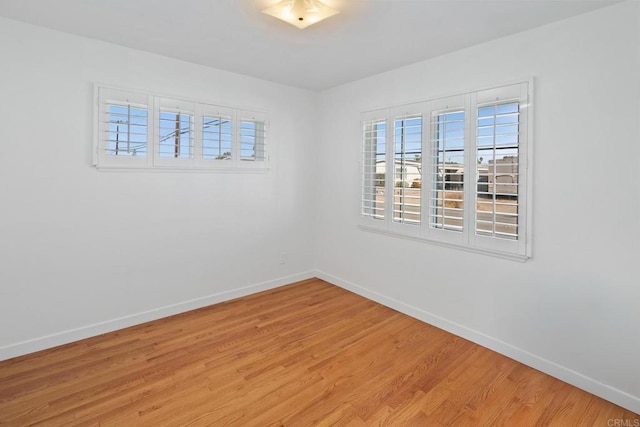 spare room featuring light hardwood / wood-style floors