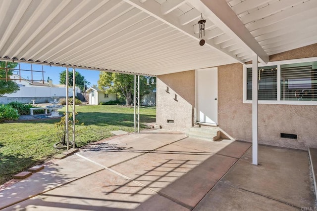 view of patio with a storage unit