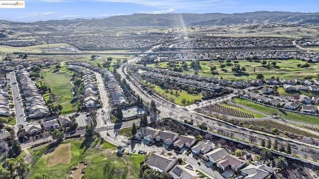 birds eye view of property with a mountain view