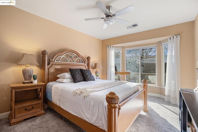 bedroom featuring ceiling fan and carpet