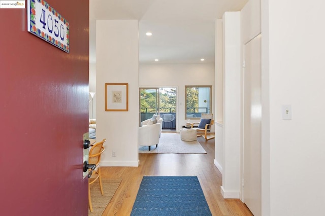 corridor featuring hardwood / wood-style floors