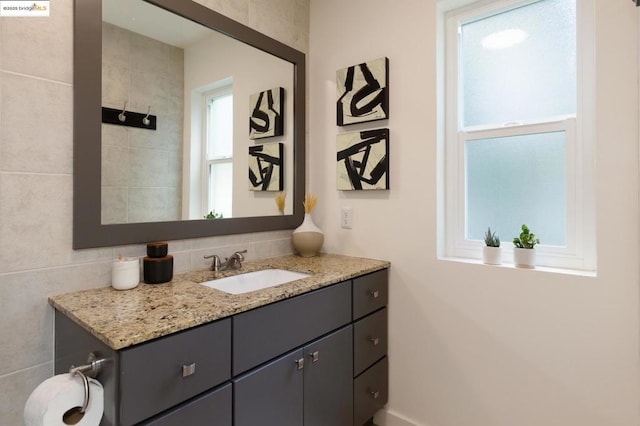 bathroom featuring backsplash and vanity