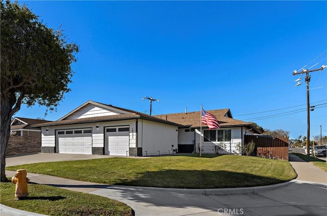 single story home featuring a front yard and a garage