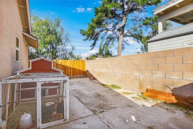 view of yard featuring central air condition unit and an outbuilding